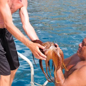 Man holds octopus