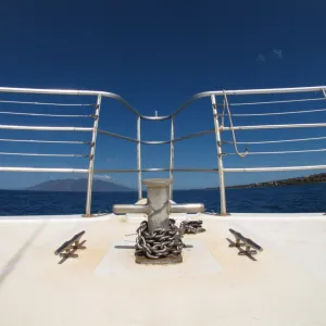 a chair sitting in front of a body of water