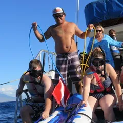 a group of people riding on the back of a boat