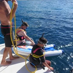 a person standing next to a body of water
