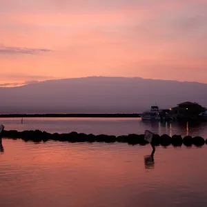 a sunset over a body of water